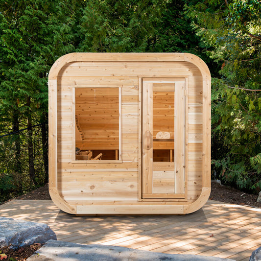 Canadian Timber Luna 4-person white cedar pod sauna, installed at the water's edge