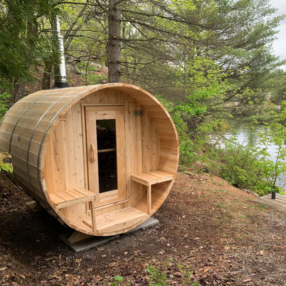 Canadian Timber Serenity 5-person white cedar barrel sauna, installed outdoors