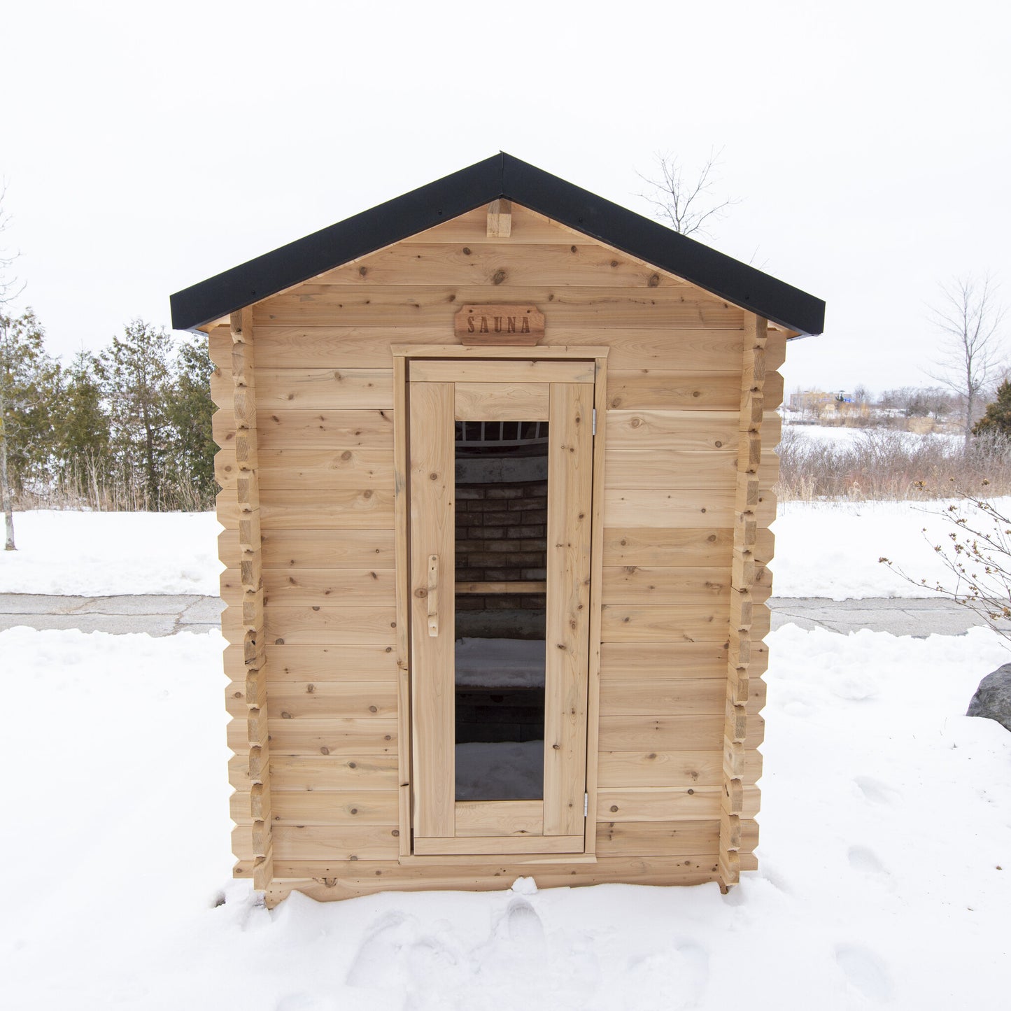Canadian Timber Granby 3-person white cedar cabin sauna, installed outdoors in snow