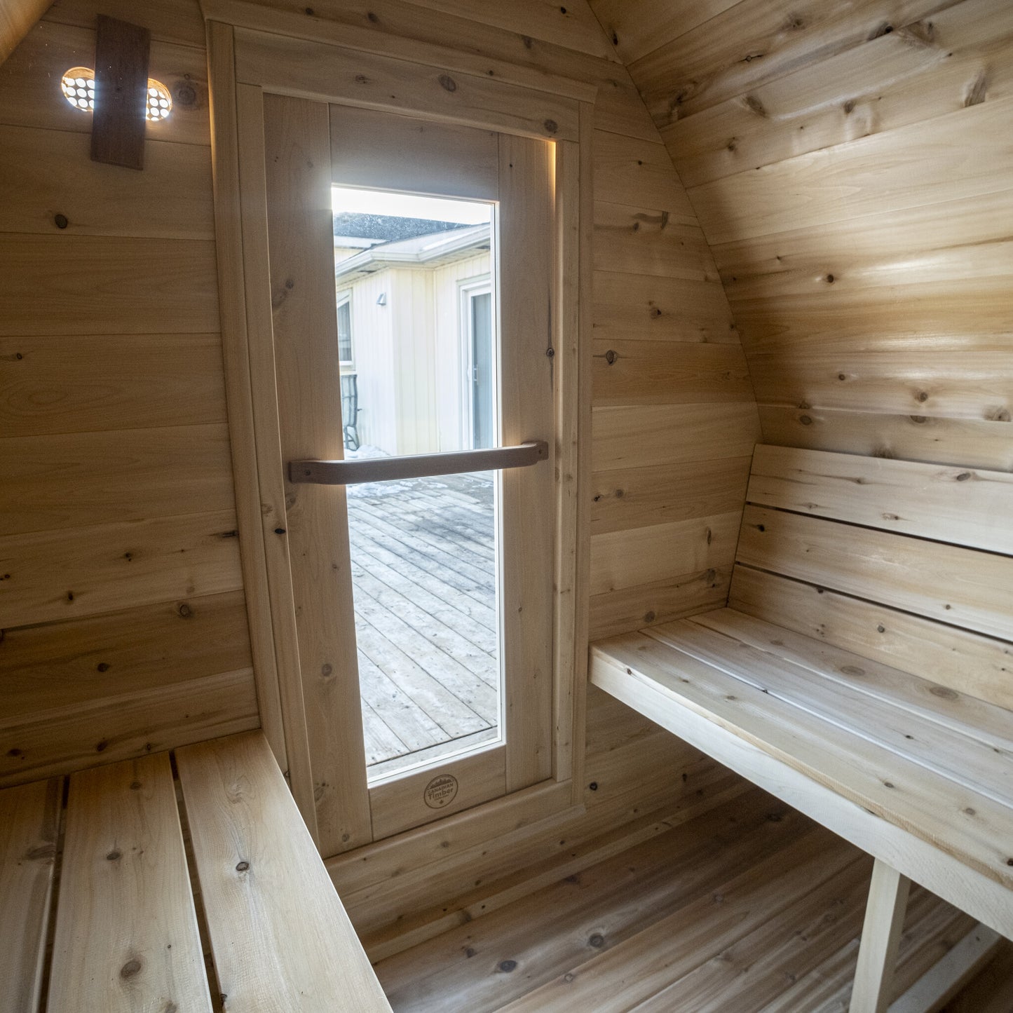 Canadian Timber Mini POD 4-person white cedar pod sauna, view out through the interior window