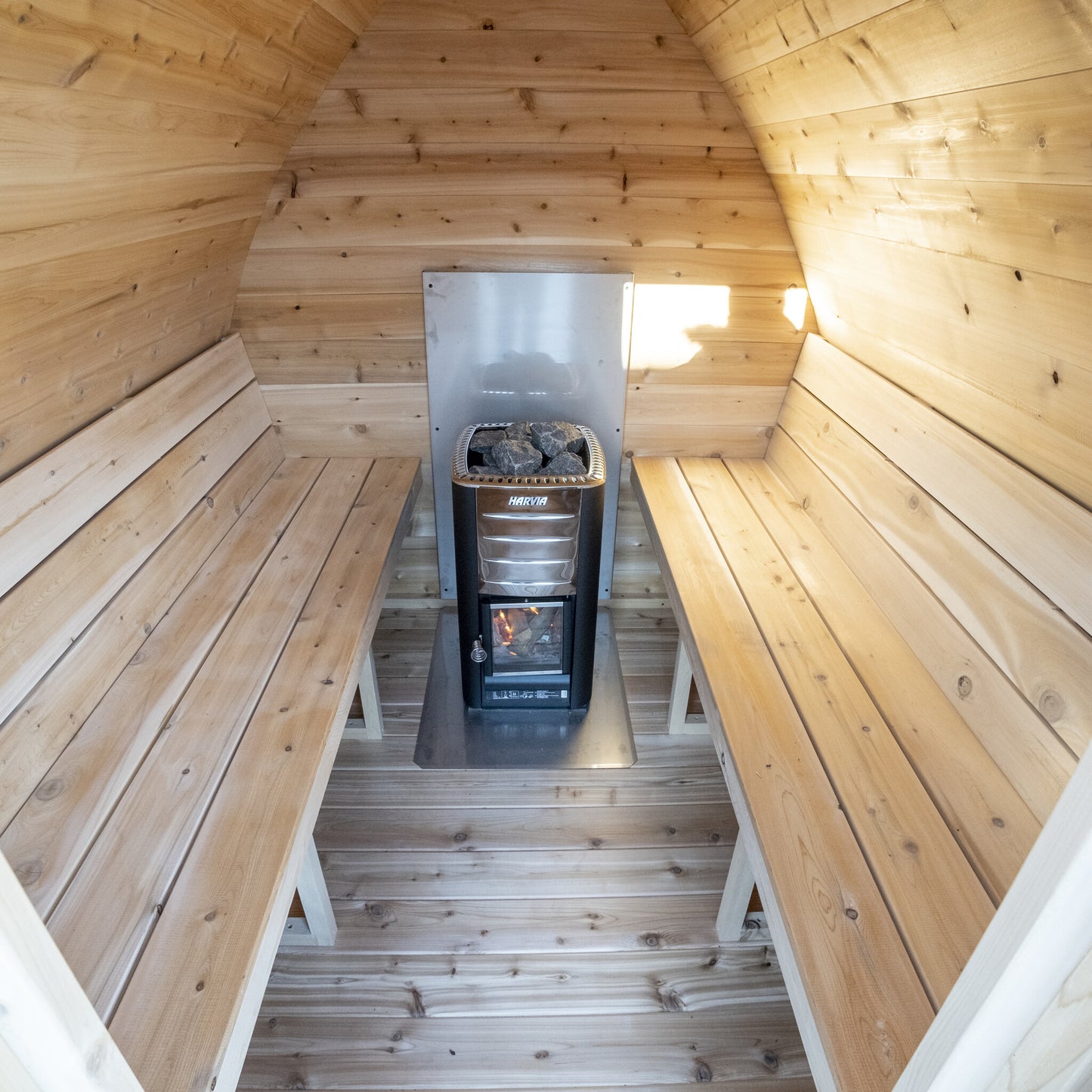 Canadian Timber Mini POD 4-person white cedar pod sauna, interior view toward the heater