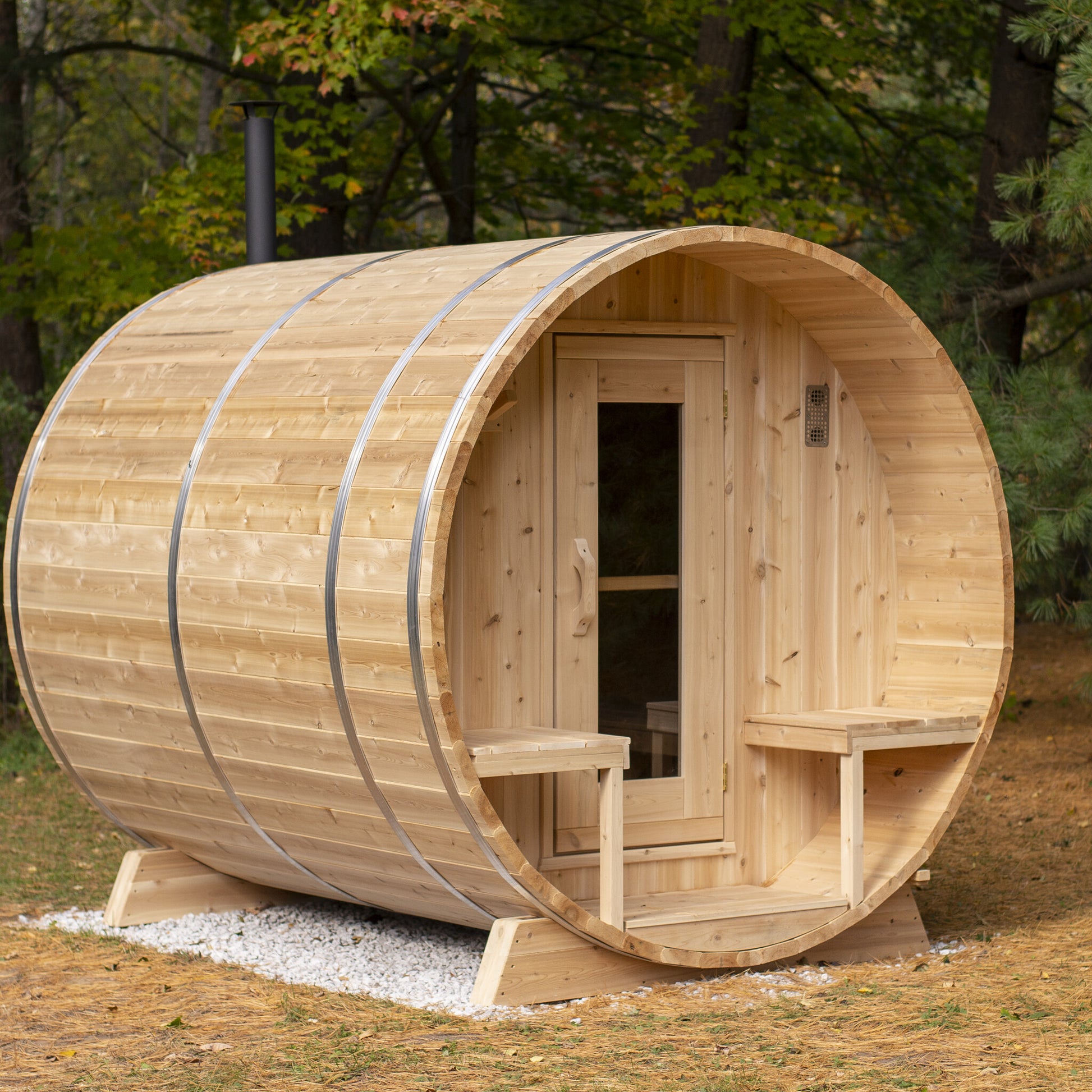 Canadian Timber Serenity 5-person white cedar barrel sauna, installed in a backyard
