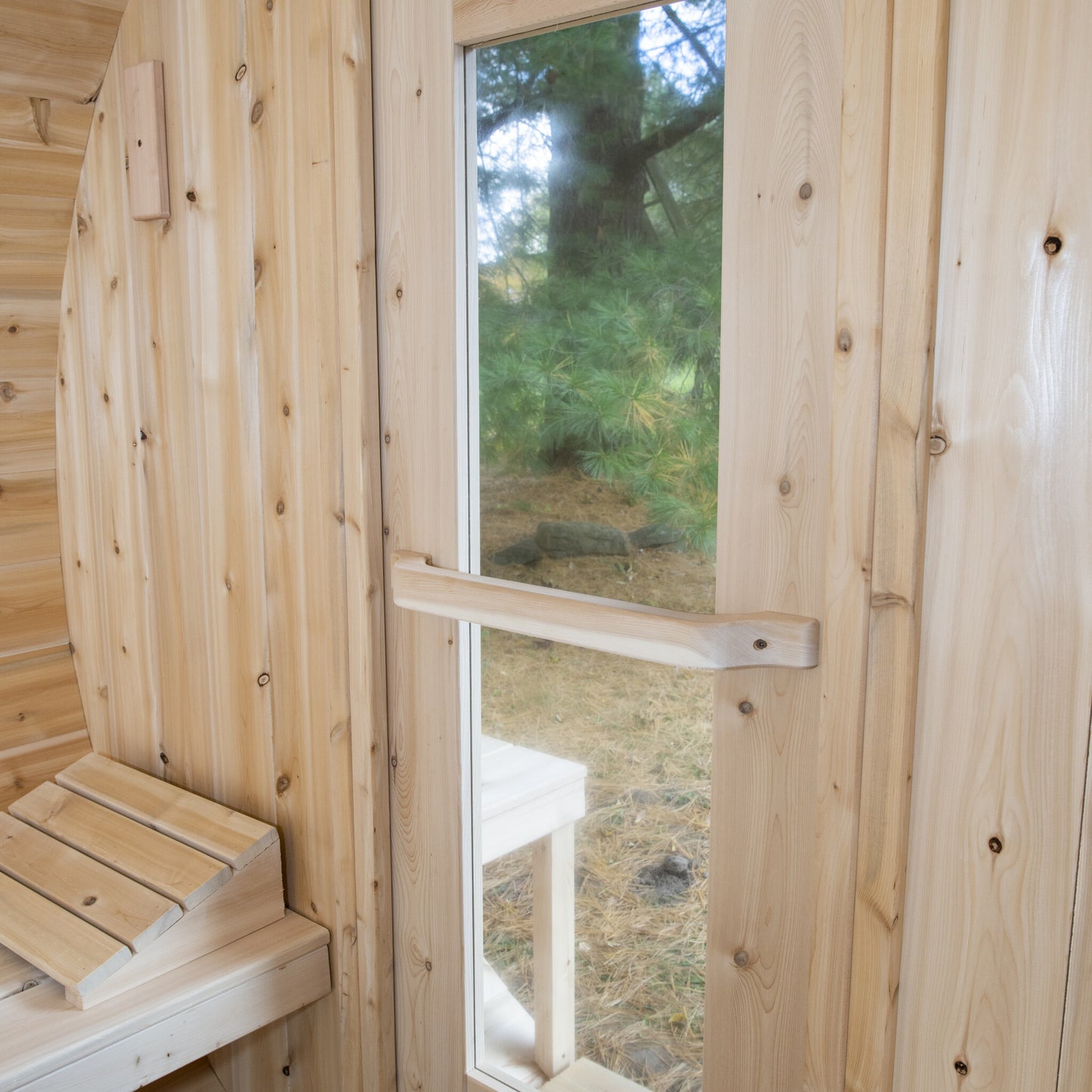 Canadian Timber Serenity 5-person white cedar barrel sauna, interior window detail