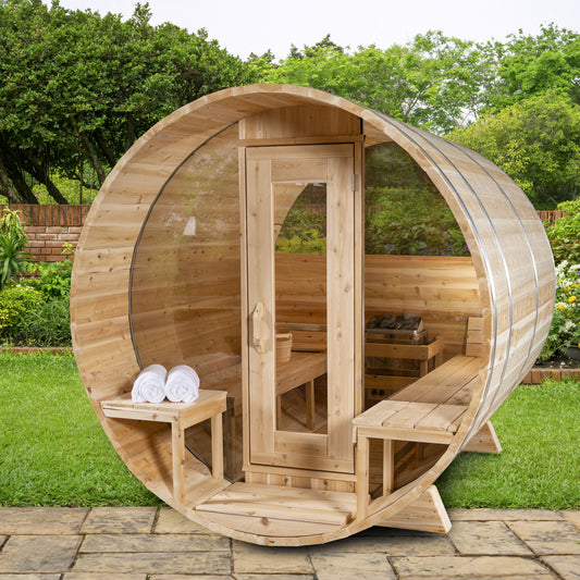 Canadian Timber Serenity with Windows 5-person white cedar barrel sauna, installed in a garden setting