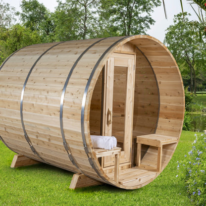 Canadian Timber Serenity with Windows 5-person white cedar barrel sauna, installed in a garden setting